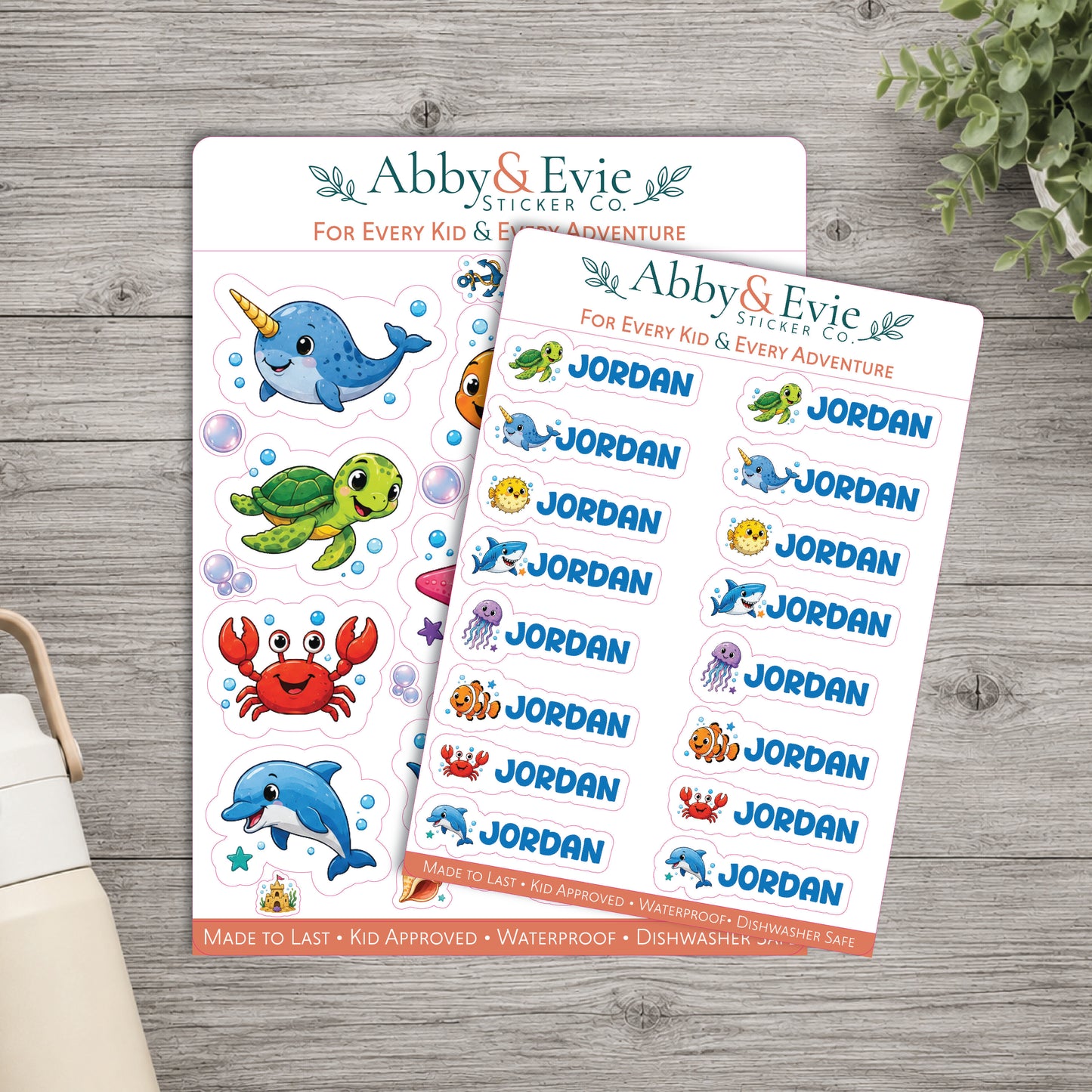 Two sheets of custom sticker names for kids from Abby & Evie Sticker Co, featuring colorful cartoon sea creatures and the name 'Jordan' repeated, displayed on a gray wood background.