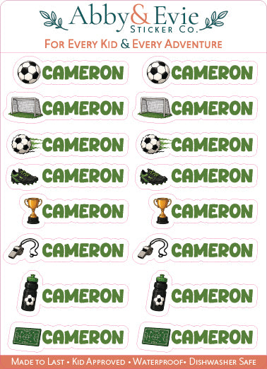 A sheet of Abby & Evie Sticker Co. custom stickers featuring the name 'CAMERON' in green text, repeated 12 times, with various soccer-themed icons like a soccer ball, goal, cleats, trophy, whistle, headset, water bottle, and turf.