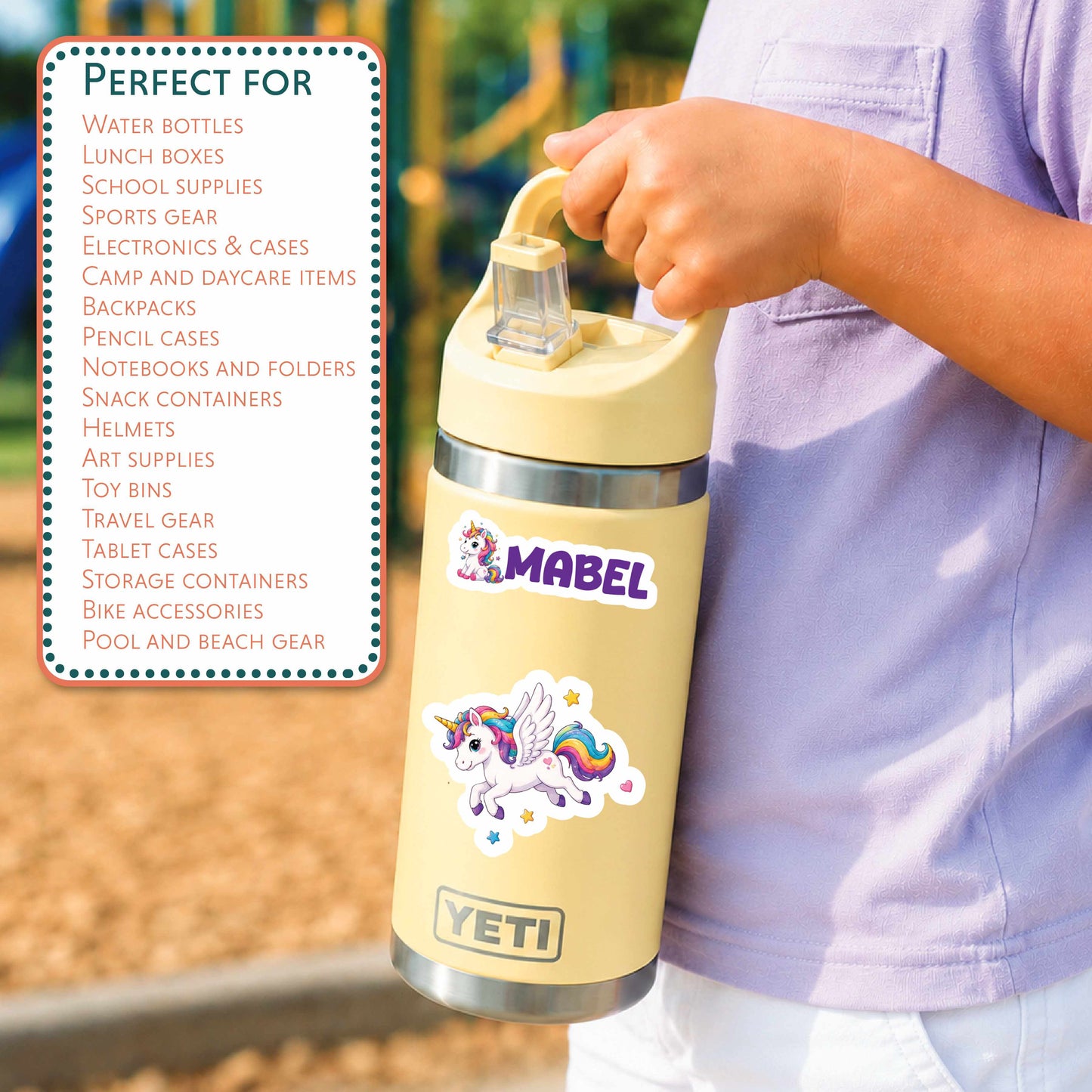 A person outdoors holds a YETI insulated water bottle with a cream lid and a matching cream body. The bottle has a colorful unicorn sticker and a purple 'MABEL' logo.