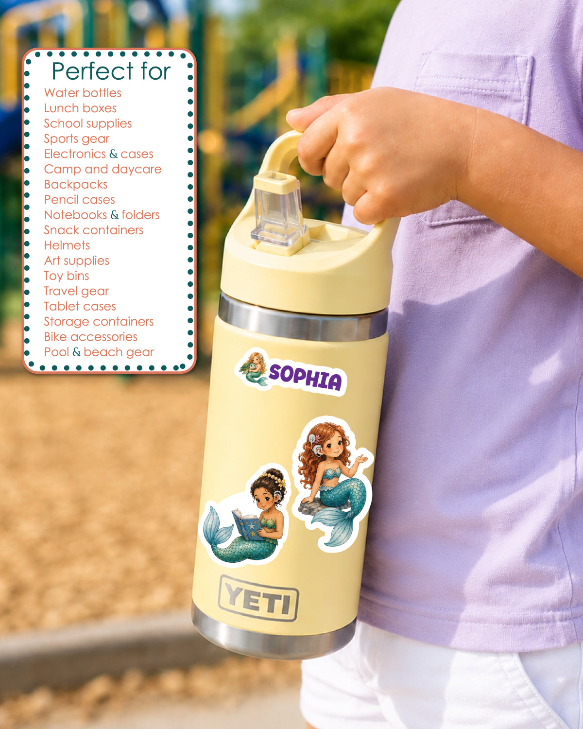 A person in a light purple shirt holds a customized YETI water bottle. The bottle has a pale yellow body with mermaids with cochlear implant stickers and the name 'SOPHIA' printed on it.